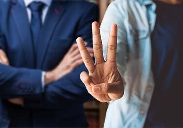 A person showing three fingers to the camera A person showing three fingers to the camera